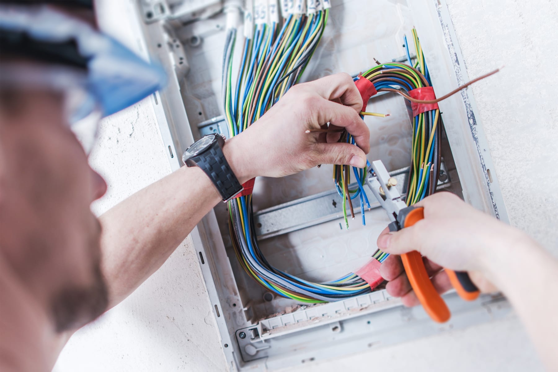 Electrician wiring a residential panel